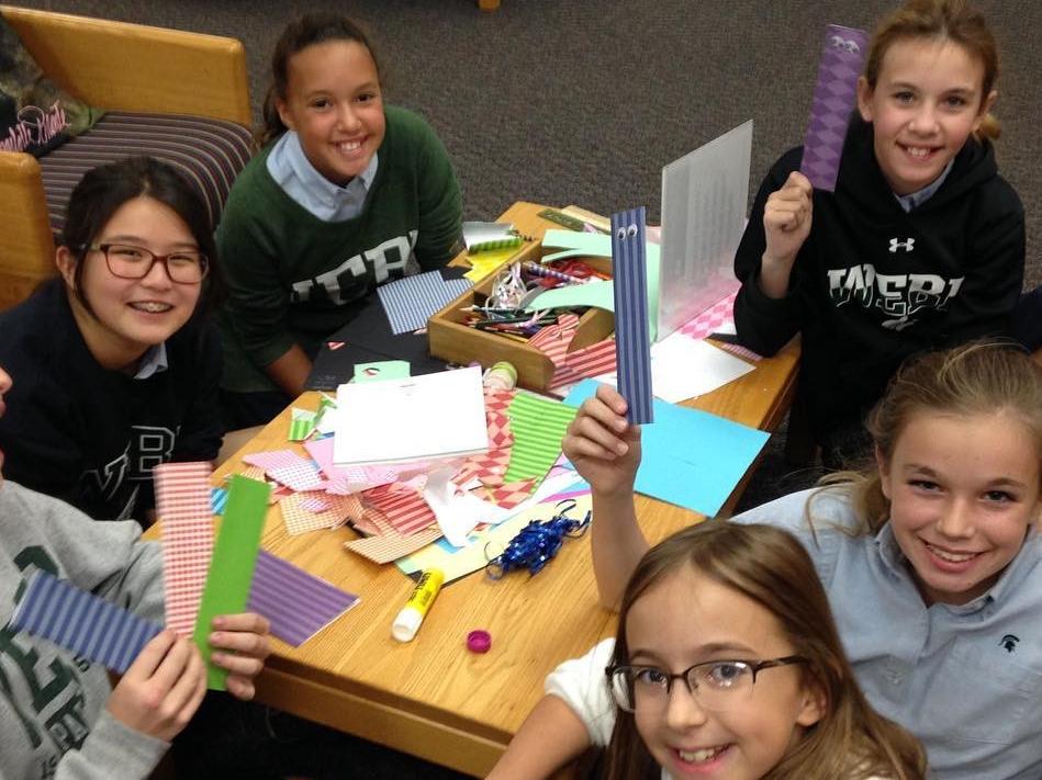 Teens making origami